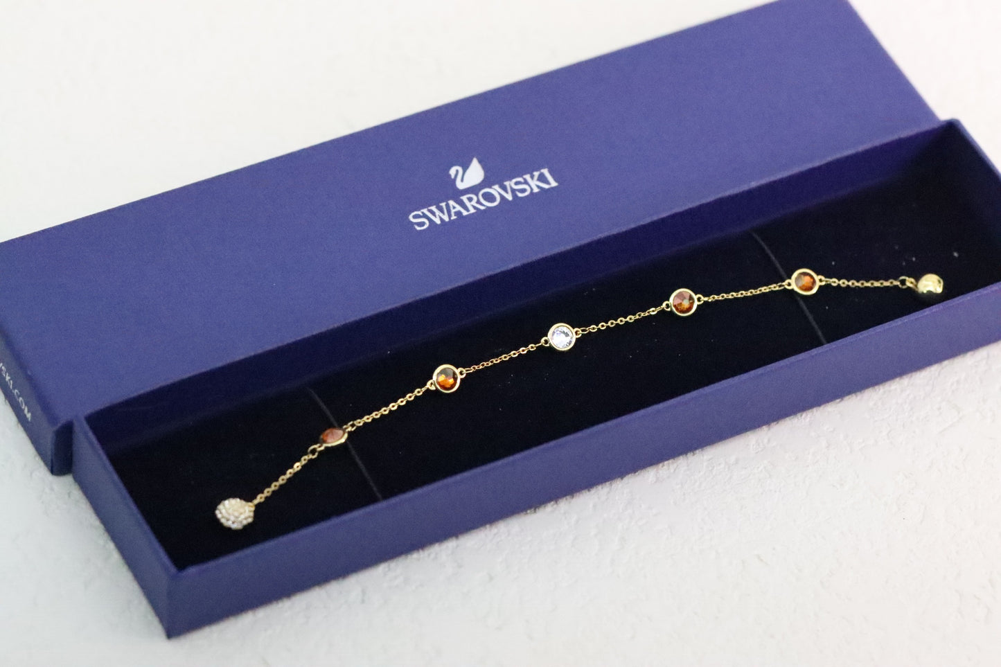 Gold-trimmed orange magnetic bracelet