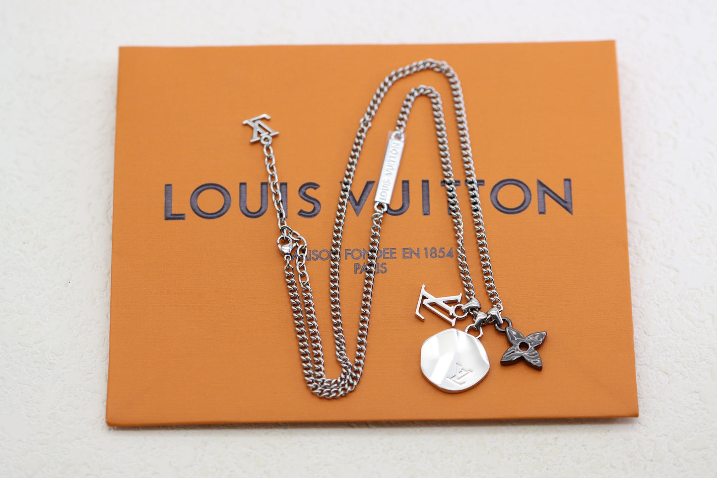 Titanium floral letter necklace