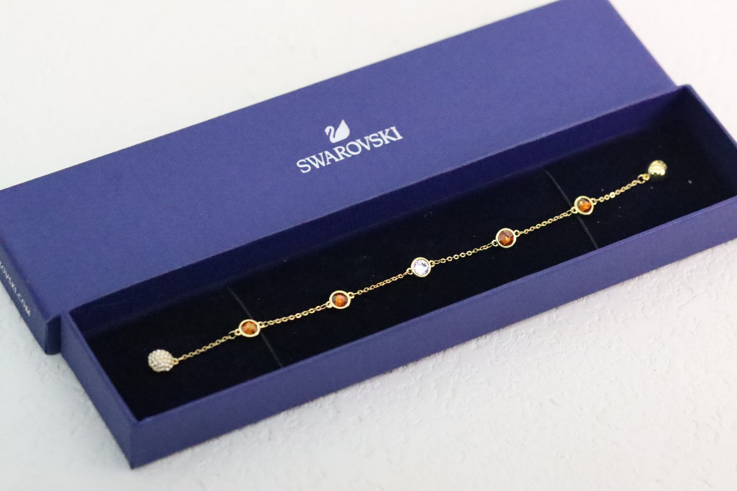 Gold-trimmed orange magnetic bracelet