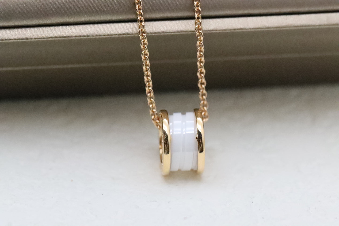 Rose gold and diamond necklace with white ceramic