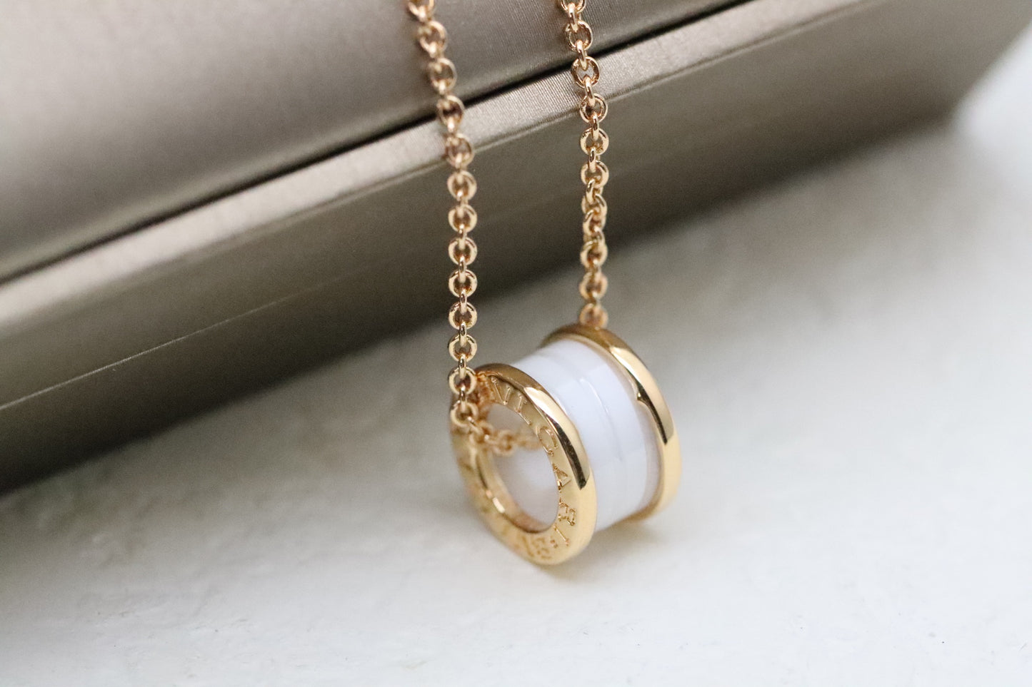 Rose gold and diamond necklace with white ceramic