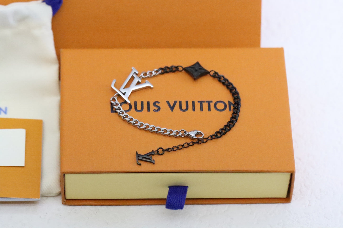 Silver and black floral and letter Cuban bracelet